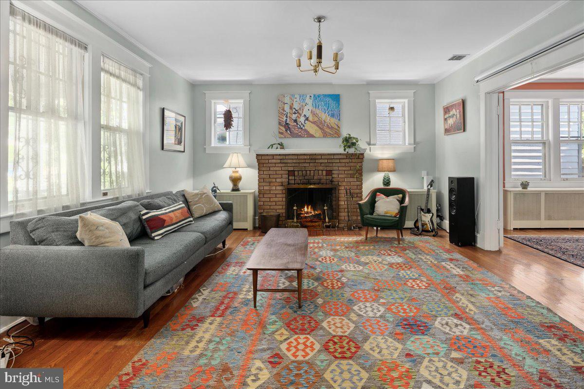 6721 Piney Branch Road Northwest Washington, DC 20012 - Photo 17 of 78 a living room with furniture and a fireplace