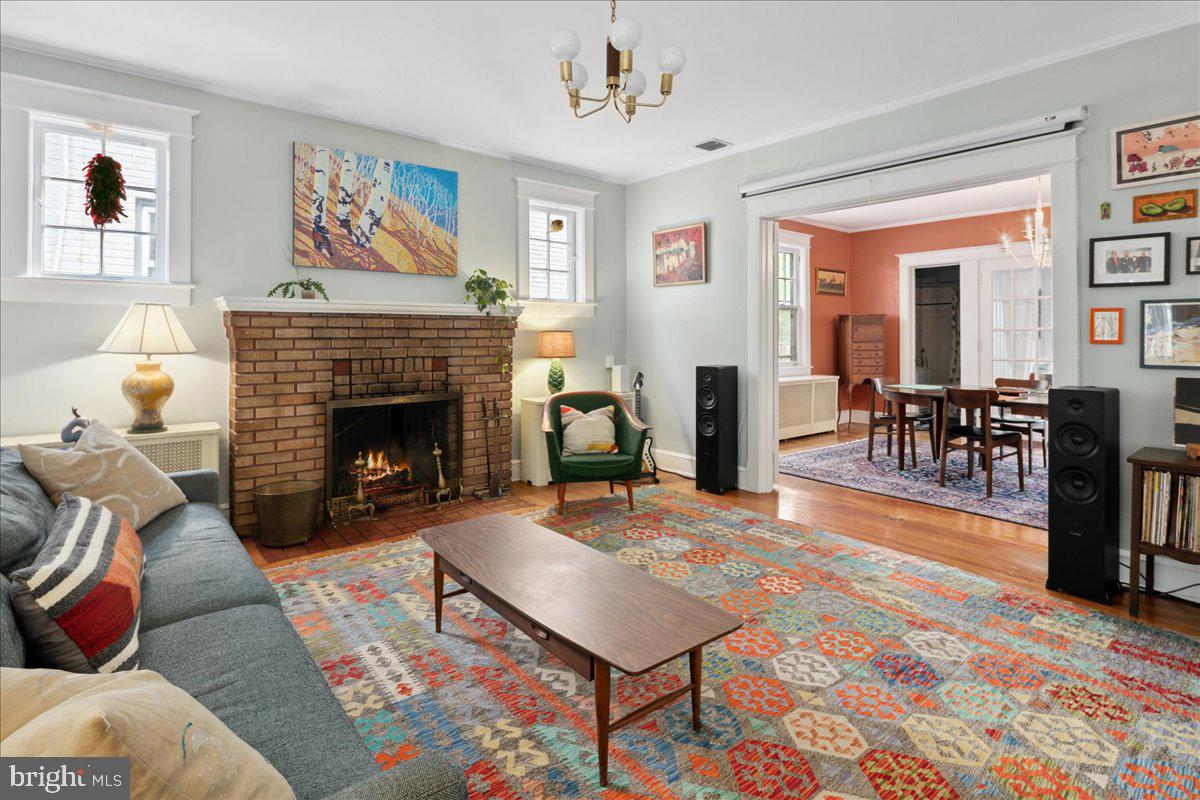 6721 Piney Branch Road Northwest Washington, DC 20012 - Photo 22 of 78 a living room with furniture a rug and a fireplace
