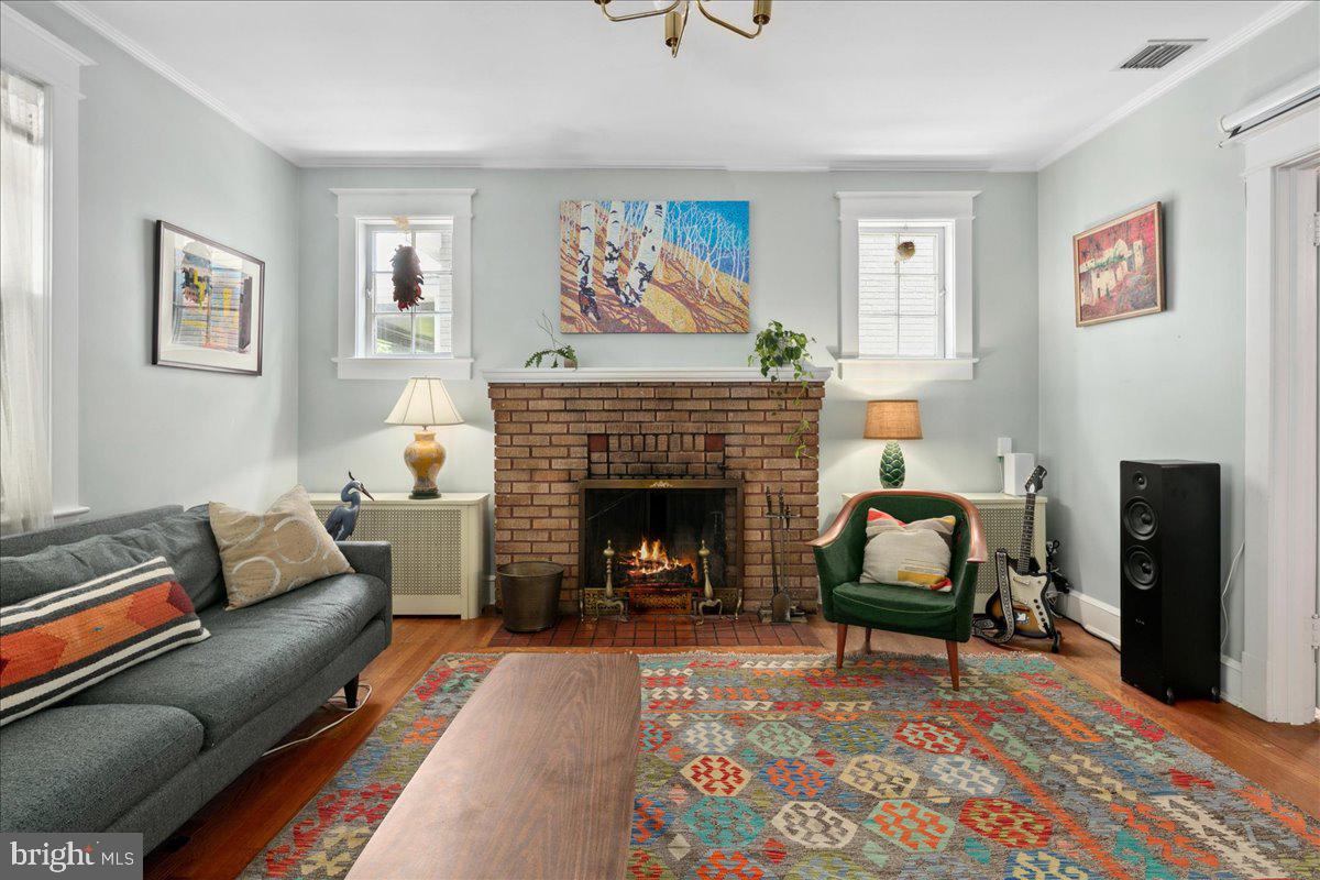 6721 Piney Branch Road Northwest Washington, DC 20012 - Photo 23 of 78 a living room with furniture and a fireplace