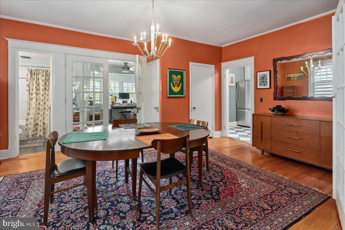 6721 Piney Branch Road Northwest Washington, DC 20012 - Photo 25 of 78 a view of a dining room with furniture window and wooden floor