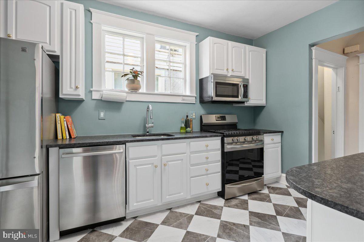 6721 Piney Branch Road Northwest Washington, DC 20012 - Photo 30 of 78 a kitchen with appliances cabinets and a window