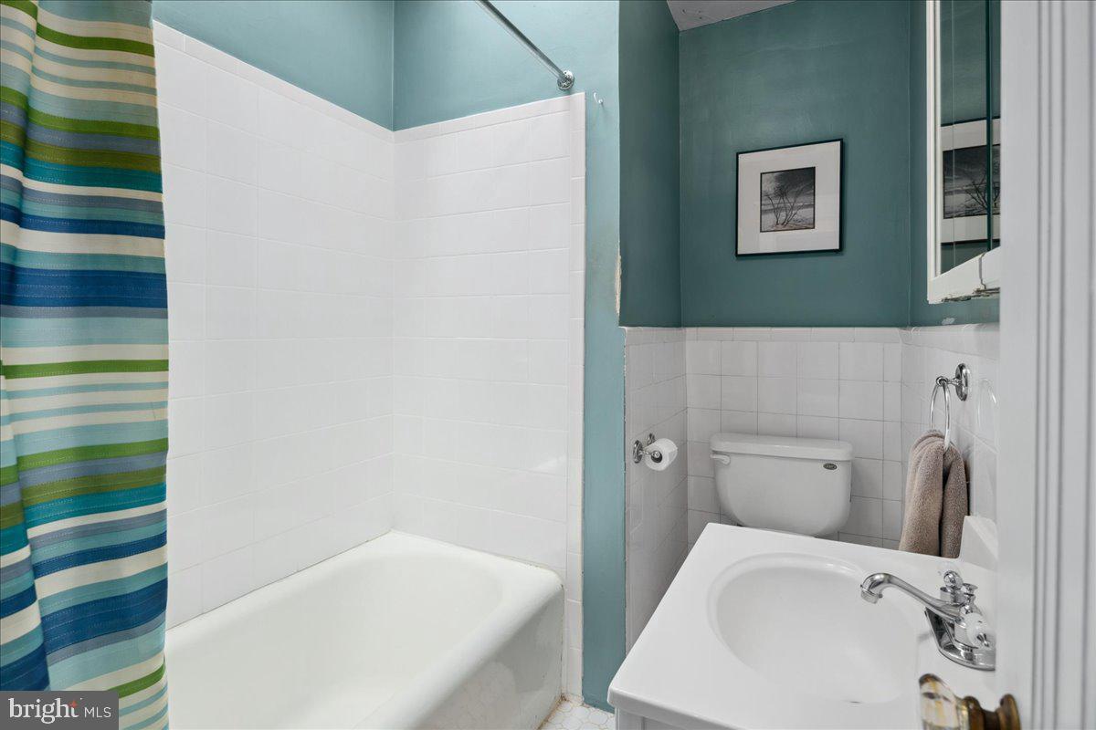 6721 Piney Branch Road Northwest Washington, DC 20012 - Photo 48 of 78 a bathroom with a sink and toilet