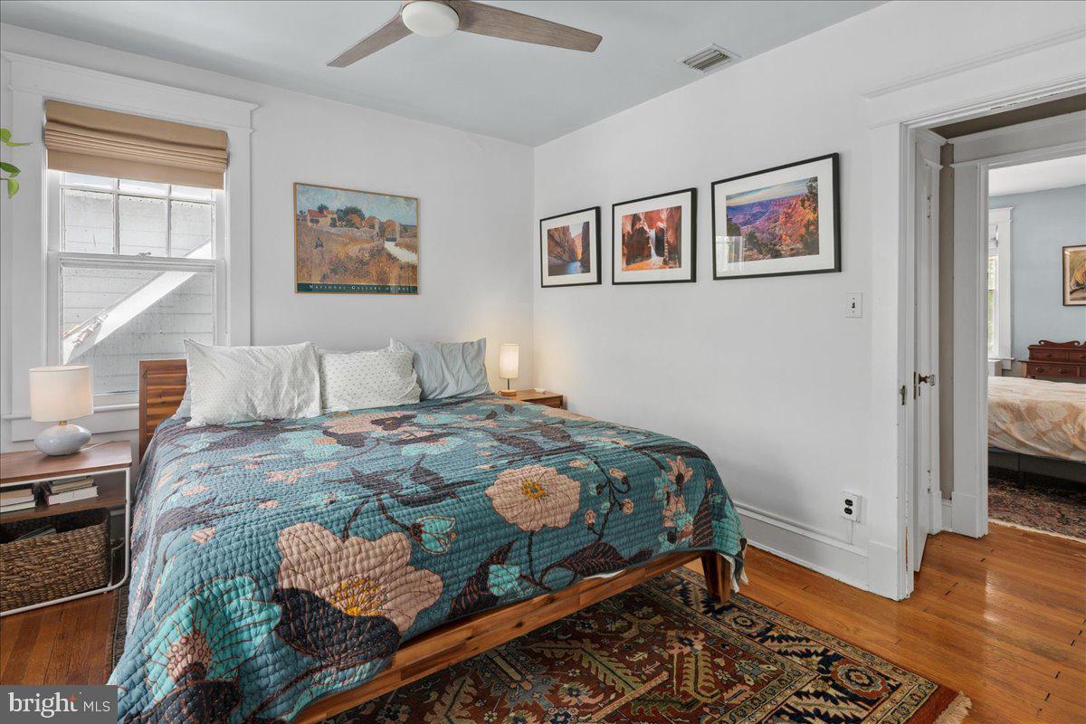 6721 Piney Branch Road Northwest Washington, DC 20012 - Photo 51 of 78 a bedroom with a bed and wooden floor