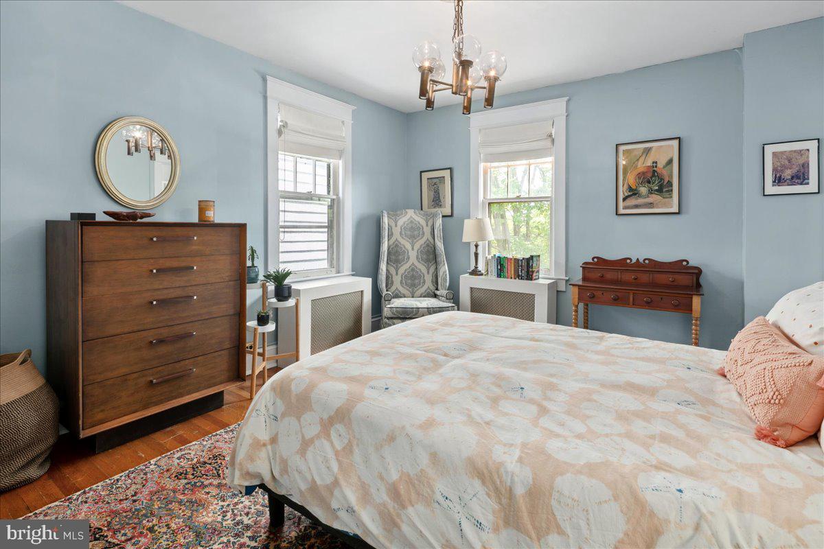 6721 Piney Branch Road Northwest Washington, DC 20012 - Photo 53 of 78 a bedroom with a bed and dresser with mirror