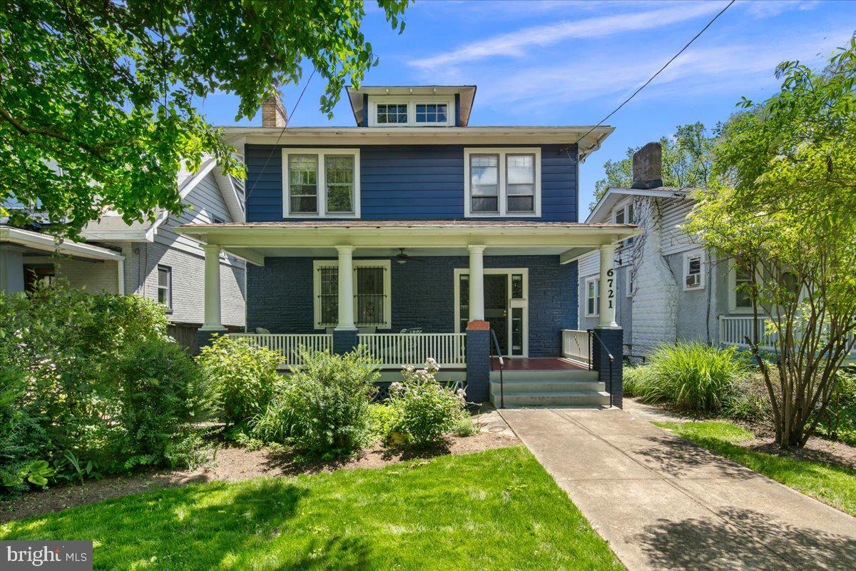 6721 Piney Branch Road Northwest Washington, DC 20012 - Photo 6 of 78 a front view of a house with garden and porch