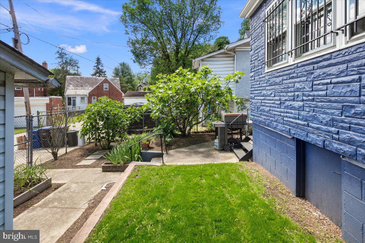 6721 Piney Branch Road Northwest Washington, DC 20012 - Photo 72 of 78 a view of a patio with table and chairs and potted plants