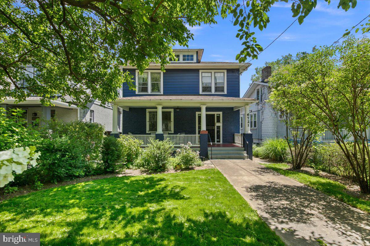 6721 Piney Branch Road Northwest Washington, DC 20012 - Photo 9 of 78 a front view of a house with garden and porch