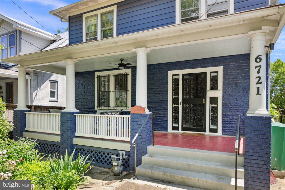 6721 Piney Branch Road Northwest Washington, DC 20012 - Photo 10 of 78 a front view of a house with a porch