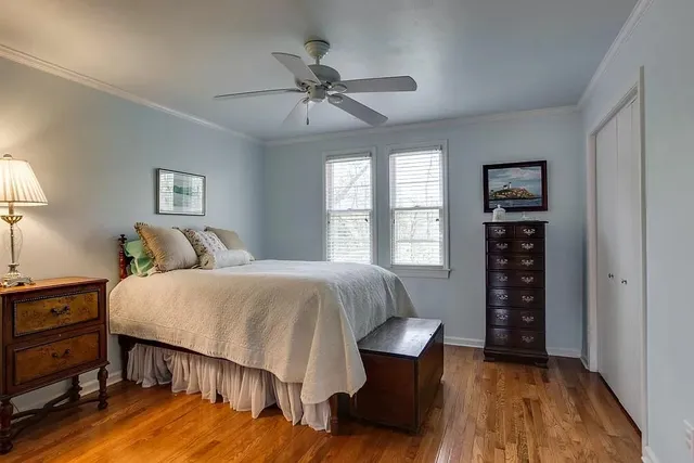 a bedroom with a bed and window