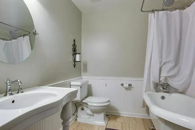 a view of a deck with furniture and wooden deck