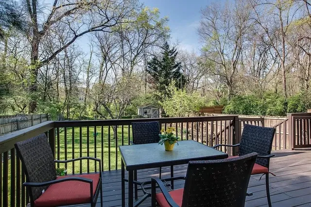 a view of a deck with two chairs and a table