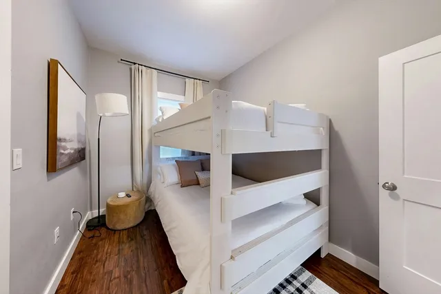 a view of living room with furniture and wooden floor