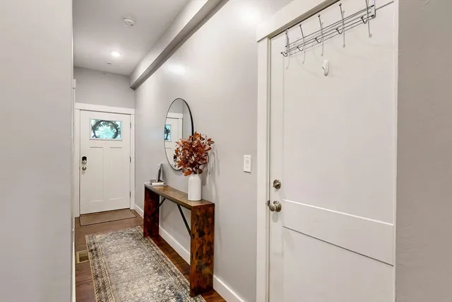 a view of bathroom with a shower and mirror