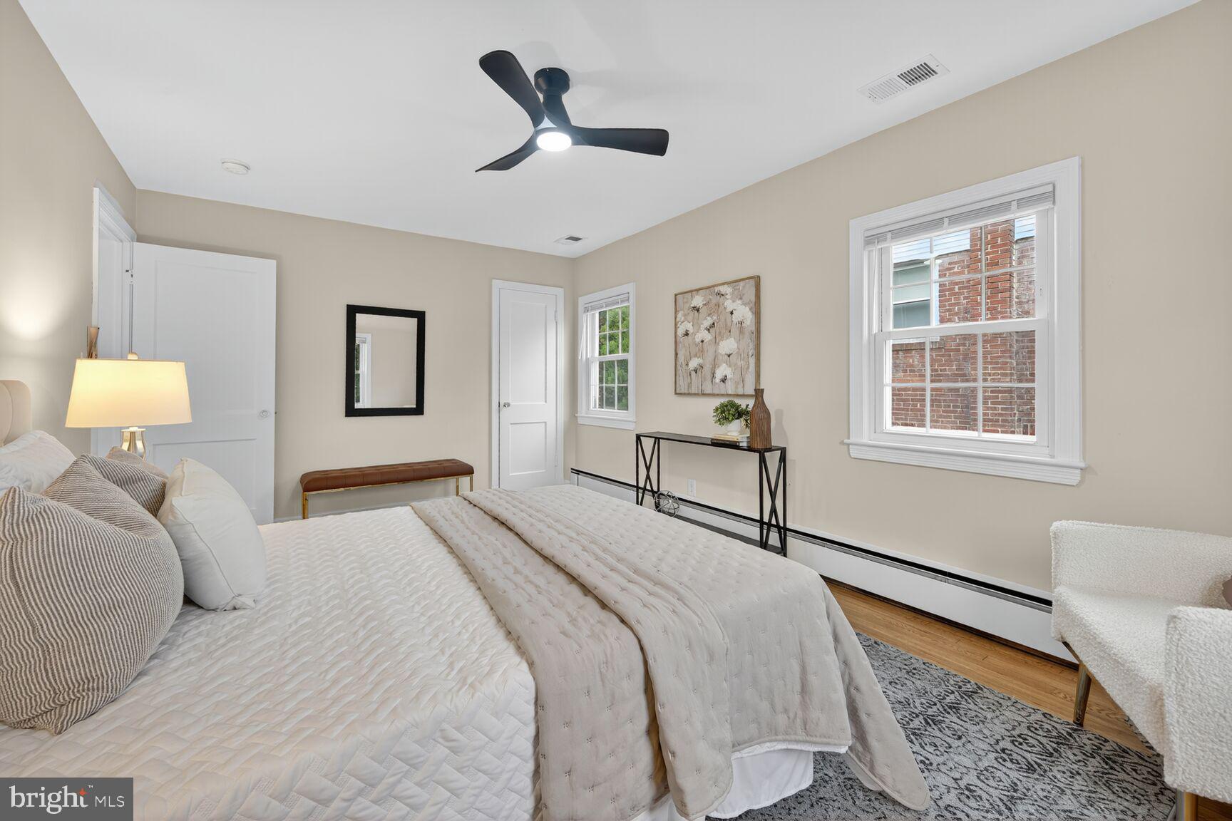 2813 Laurel Avenue Cheverly, MD 20785 - Photo 17 of 30 a bedroom with a bed wooden floor and window