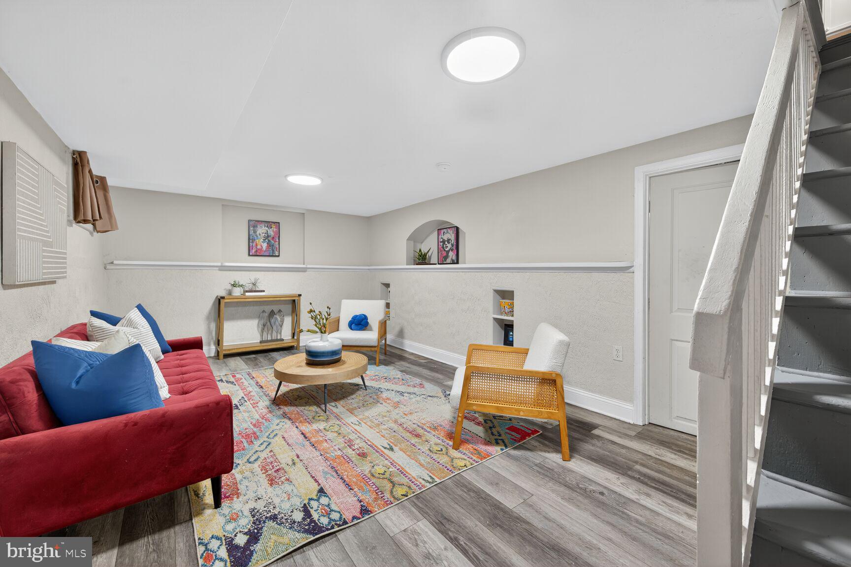 2813 Laurel Avenue Cheverly, MD 20785 - Photo 25 of 30 a living room with furniture and a wooden floor