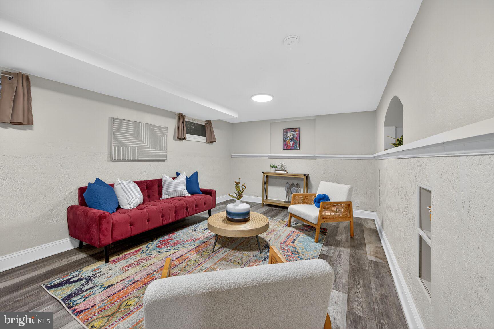 2813 Laurel Avenue Cheverly, MD 20785 - Photo 26 of 30 a living room with furniture and wooden floor