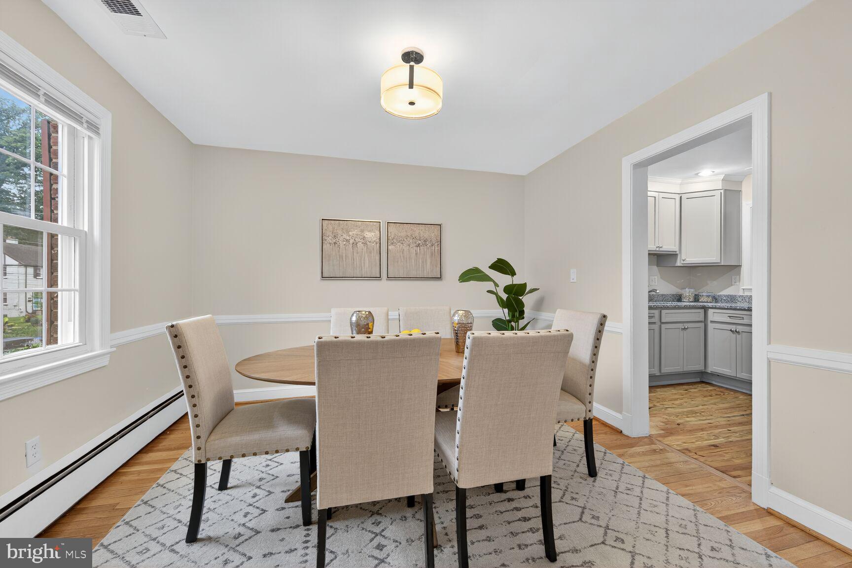 2813 Laurel Avenue Cheverly, MD 20785 - Photo 5 of 30 a view of a dining room with furniture window and wooden floor
