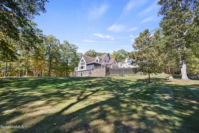 a living room with fireplace furniture and a flat screen tv