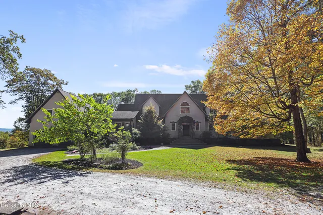 a front view of a house with a porch