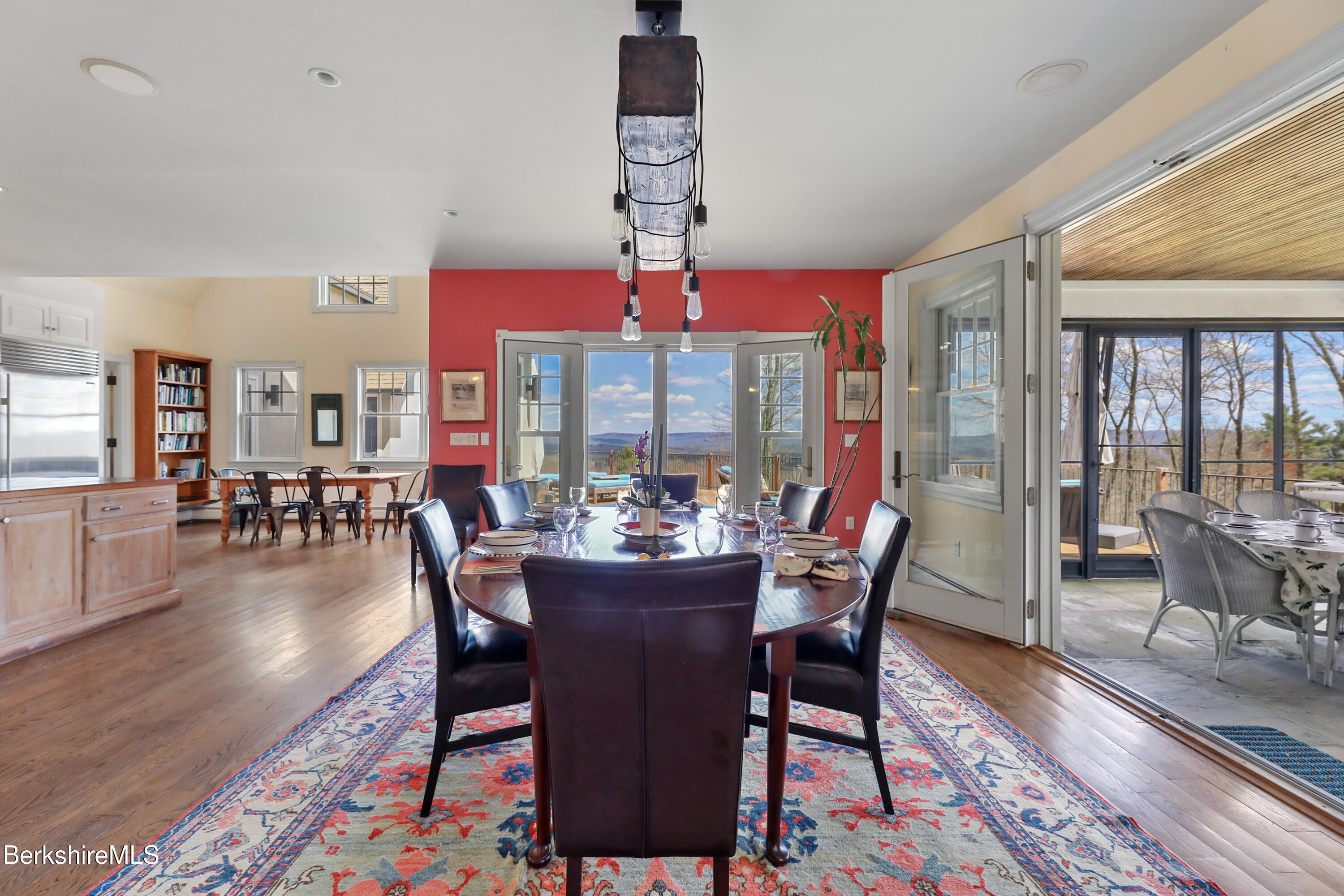 36 Millard Road Egremont, MA 01230 - Photo 37 of 93 a dining room with wooden floor a chandelier a wooden table and chairs