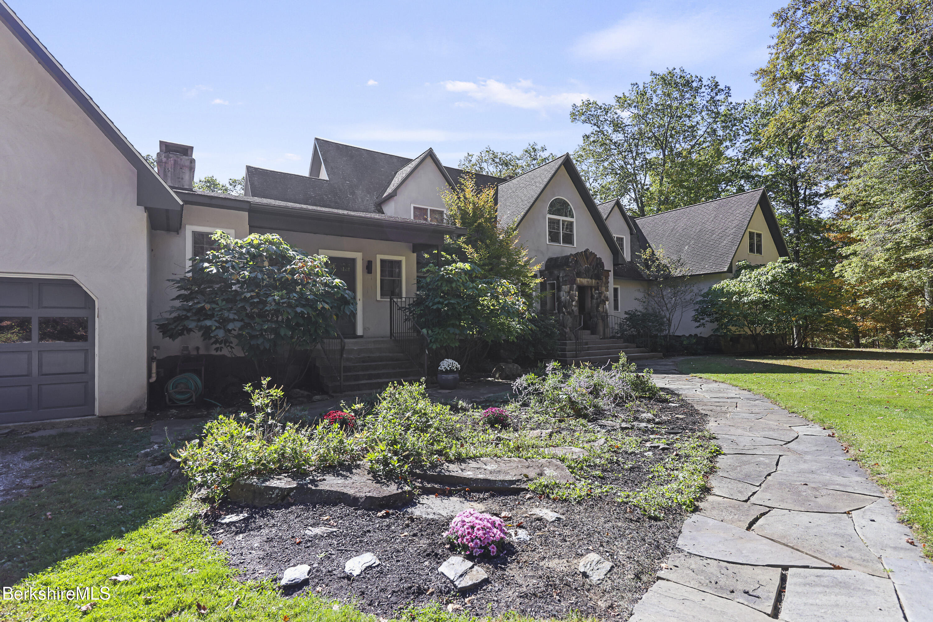 36 Millard Road Egremont, MA 01230 - Photo 4 of 93 a house with lots of flowers in front of it