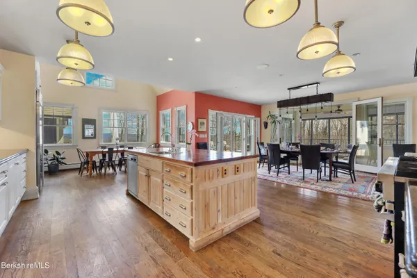 a view of living room filled with furniture and wooden floor
