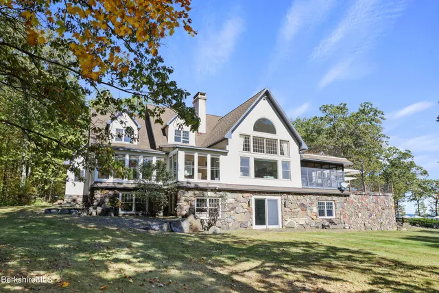 a room with furniture a rug and a window
