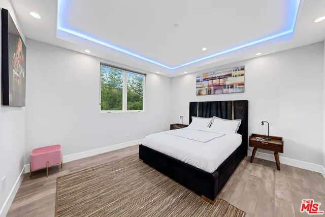 a bedroom with a bed and a table