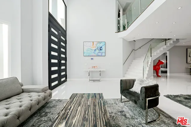 a living room with furniture and a rug