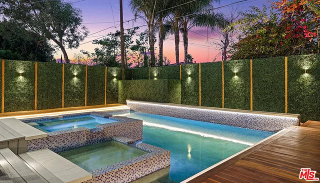 a view of swimming pool with a patio