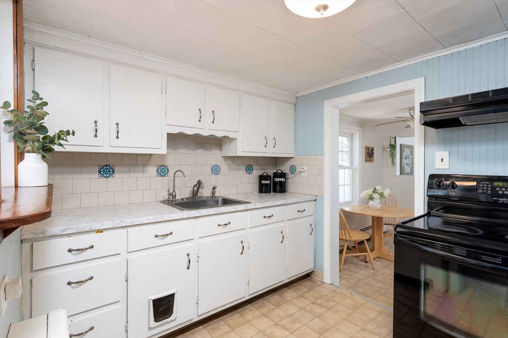 46 West Shore Road Holbrook, MA 02343 - Photo 13 of 33 a kitchen with cabinets and appliances