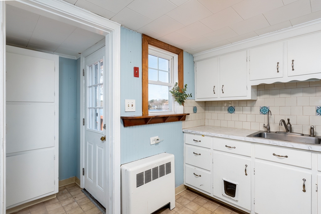 46 West Shore Road Holbrook, MA 02343 - Photo 14 of 33 a kitchen with granite countertop white cabinets and white appliances