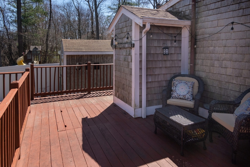46 West Shore Road Holbrook, MA 02343 - Photo 23 of 33 a view of a wooden chairs and a table in the balcony