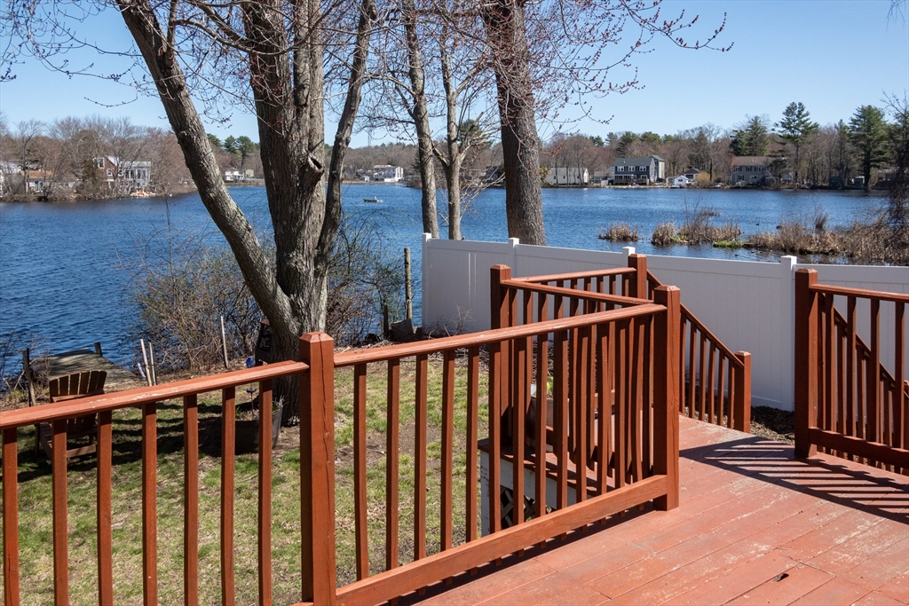 46 West Shore Road Holbrook, MA 02343 - Photo 24 of 33 a view of balcony with wooden fence and trees