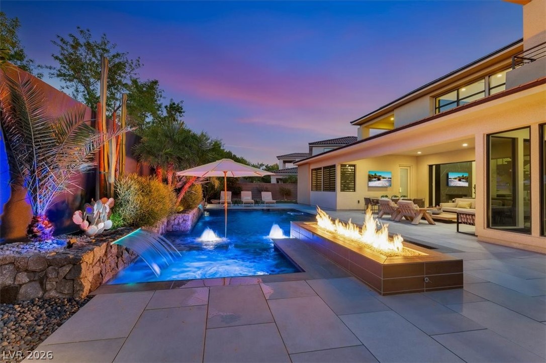 53 Garibaldi Way Henderson, NV 89011 - Photo 1 of 80 View of pool featuring a patio area, and outdoor fire pit.