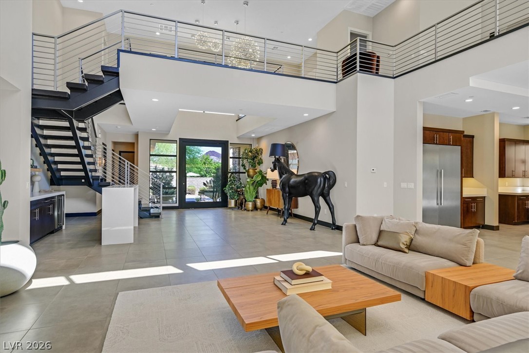 53 Garibaldi Way Henderson, NV 89011 - Photo 11 of 80 Living area with high ceiling, stairs, and recessed lighting