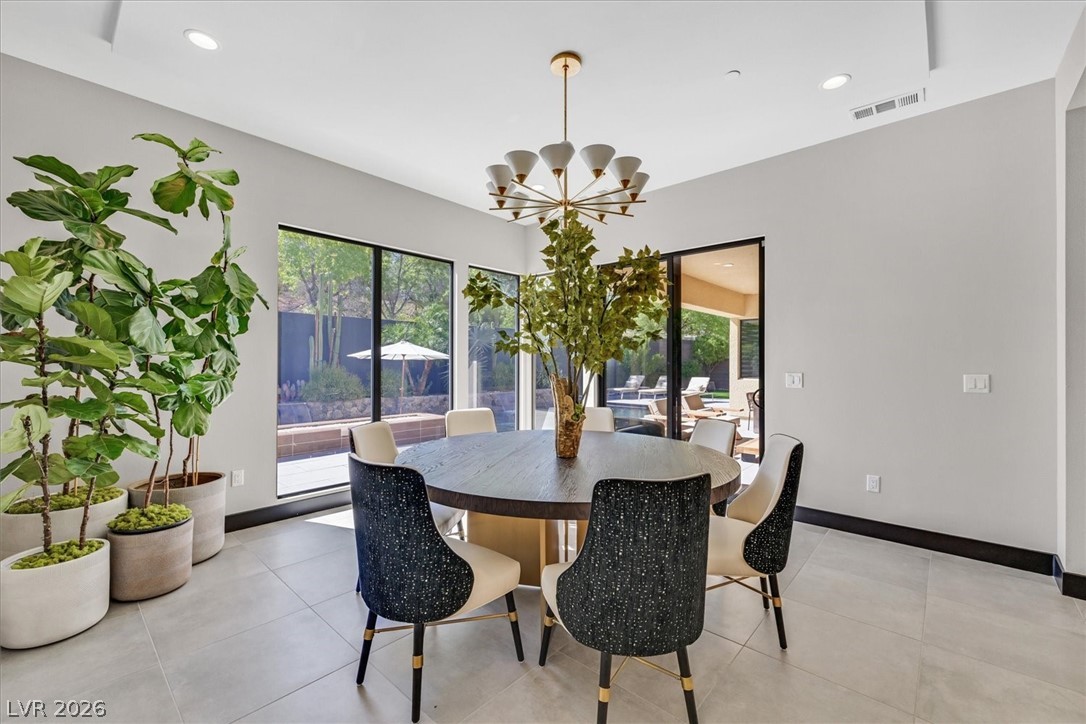 53 Garibaldi Way Henderson, NV 89011 - Photo 24 of 80 Dining area with recessed lighting, a chandelier, and light tile patterned floors