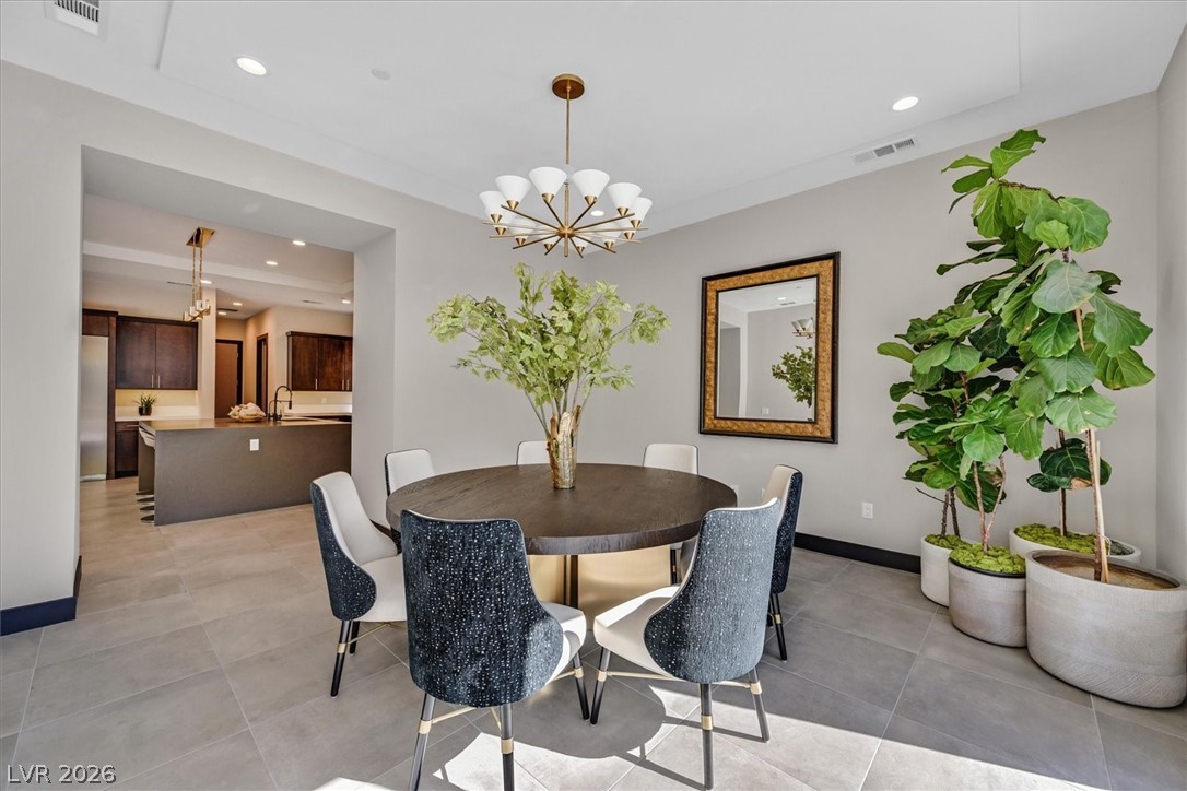 53 Garibaldi Way Henderson, NV 89011 - Photo 25 of 80 Dining area with recessed lighting, a chandelier, and light tile patterned flooring