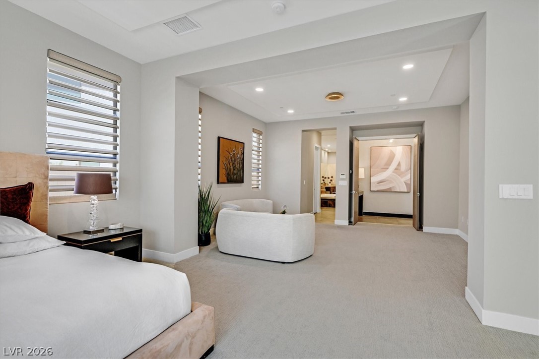 53 Garibaldi Way Henderson, NV 89011 - Photo 29 of 80 Bedroom with light carpet, recessed lighting, and ensuite bath