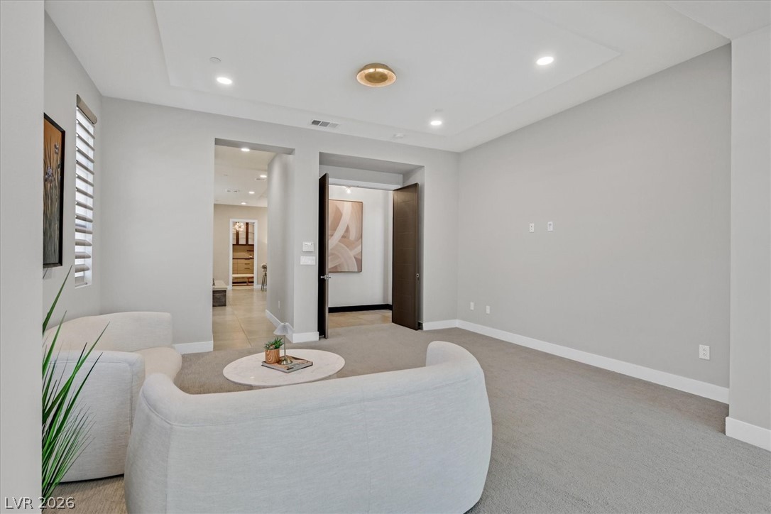 53 Garibaldi Way Henderson, NV 89011 - Photo 30 of 80 Sitting room featuring light carpet and recessed lighting