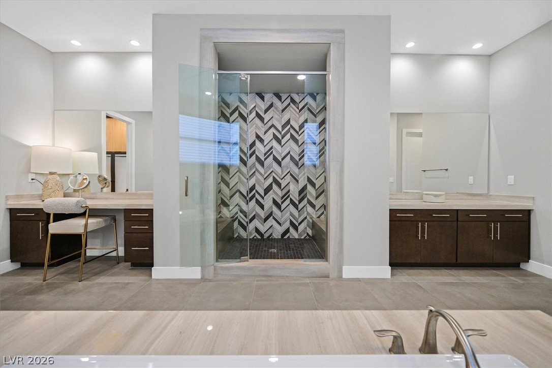 53 Garibaldi Way Henderson, NV 89011 - Photo 33 of 80 Bathroom with a stall shower, recessed lighting, vanity, and light tile patterned floors