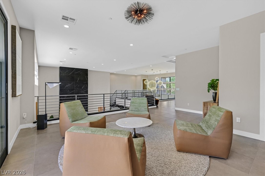 53 Garibaldi Way Henderson, NV 89011 - Photo 44 of 80 Living room with light tile patterned floors and recessed lighting