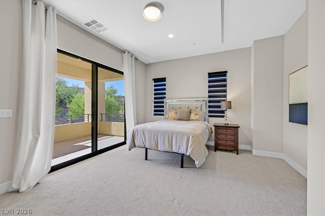 53 Garibaldi Way Henderson, NV 89011 - Photo 45 of 80 Carpeted bedroom featuring access to outside balcony and golf views
