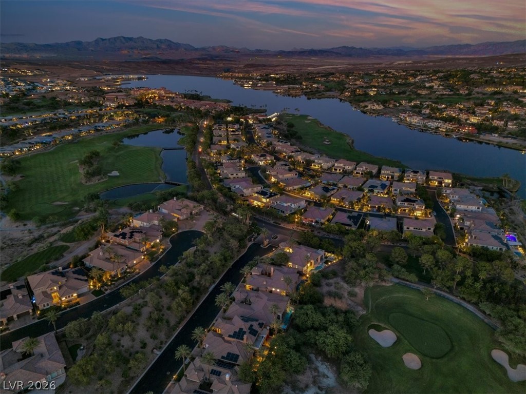53 Garibaldi Way Henderson, NV 89011 - Photo 64 of 80 Aerial view at dusk of a residential view, view of golf course, and a water and mountain view