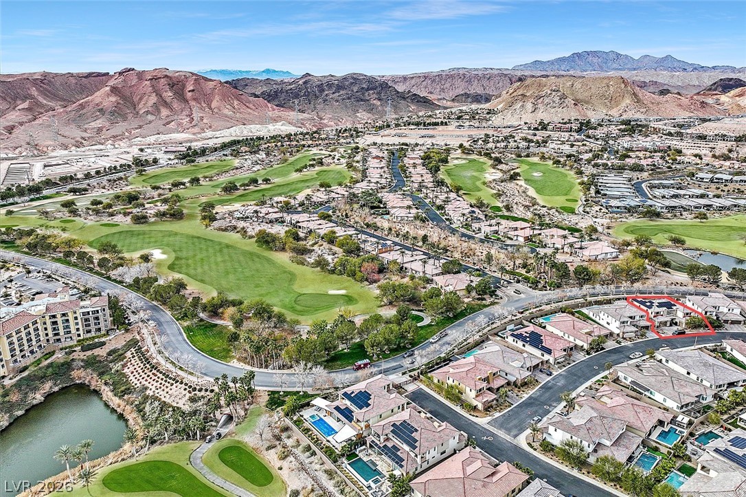 53 Garibaldi Way Henderson, NV 89011 - Photo 75 of 80 Aerial view of property and surrounding area featuring a golf club and nearby suburban area