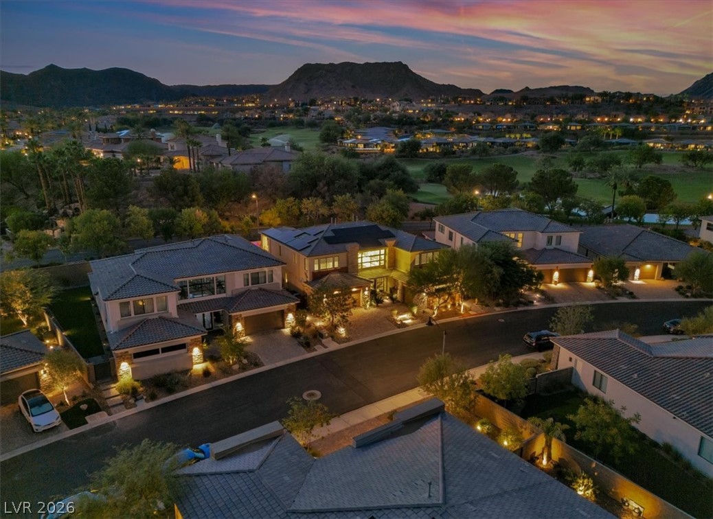 53 Garibaldi Way Henderson, NV 89011 - Photo 8 of 80 Aerial view at dusk of a residential view and a mountain view