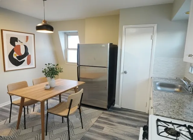 a kitchen with a refrigerator and countertop