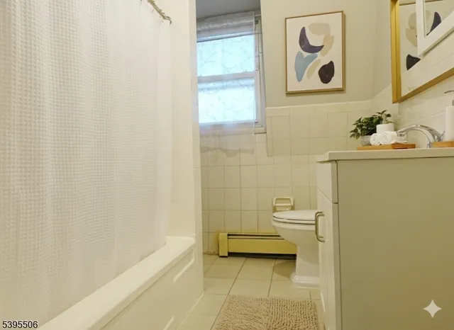 a bathroom with a bathtub and sink