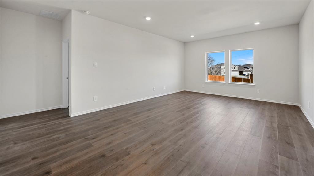 3343 Spaulding Drive Paris, TX 75460 - Photo 29 of 35 a view of room with wooden floor and window