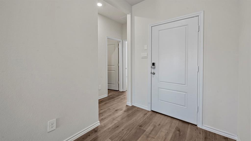 3343 Spaulding Drive Paris, TX 75460 - Photo 6 of 35 a view of a hallway with wooden floor